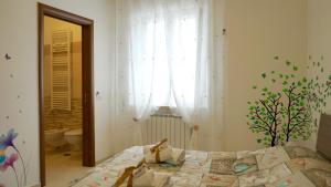 Postel nebo postele na pokoji v ubytování La Lanterna Sul Comò