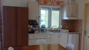 Kuchyň nebo kuchyňský kout v ubytování Potokia Rooms