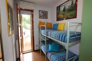 A bed or beds in a room at FLAT BIBIONE
