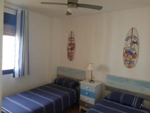 Posteľ alebo postele v izbe v ubytovaní Apartamento el Atunito, Atlanterra
