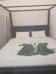 Postel nebo postele na pokoji v ubytování Shiva's Beach Cabanas