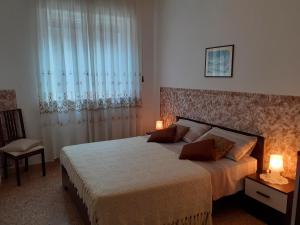 Posteľ alebo postele v izbe v ubytovaní Saglia Apartments