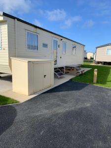 a mobile home with its door open on a driveway at Marton mere in Blackpool