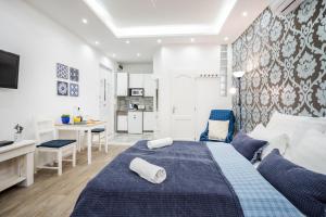 Ένα ή περισσότερα κρεβάτια σε δωμάτιο στο BpR SHINY Deluxe Home