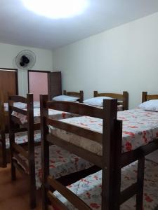 a bedroom with three bunk beds in a room at Hostel My Place Hospedaria in Salvador