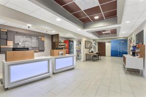 a lobby of a store with two blank signs at Holiday Inn Express Hotel & Suites Byron, an IHG Hotel in Byron