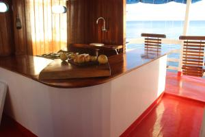 a kitchen with a wooden counter top with fruit on it at Selvagem Tours in Alter do Chao