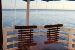 a table and two chairs on a cruise ship at Selvagem Tours in Alter do Chao