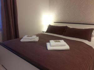 Posteľ alebo postele v izbe v ubytovaní Cracow Central Aparthotel