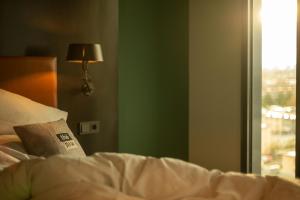 Postel nebo postele na pokoji v ubytování Holiday Inn - the niu, Fender Amsterdam