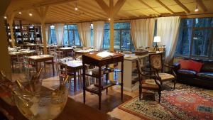 a restaurant with tables and chairs in a room at RICASOLI, Brolio Agriroom in Gaiole in Chianti