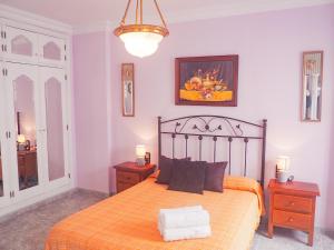 Ein Bett oder Betten in einem Zimmer der Unterkunft ConilPlus Apartment LORCA