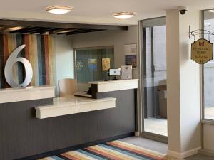 an office with a mirror on the wall at Motel 6 Louisville, Ky- Airport/ Fair Expo in Louisville