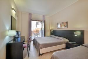 Postel nebo postele na pokoji v ubytování Hotel Mareluna