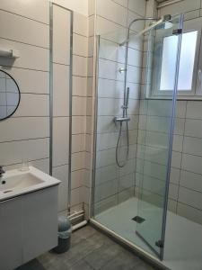 a bathroom with a glass shower and a sink at Come Inn in Neufchâtel-en-Bray +40 photos