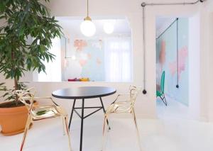 a dining room with a table and two chairs at Trilogy Experimental in Thessaloniki