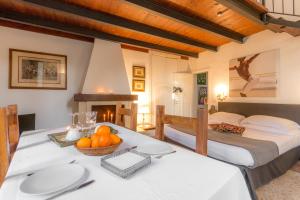 a bedroom with two beds and a table with fruit on it at B&B Villa I 2 Leoni in Lecce