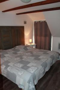 Ένα ή περισσότερα κρεβάτια σε δωμάτιο στο Appartement Mirabelle avec Jardin - Centre Ribeauvillé