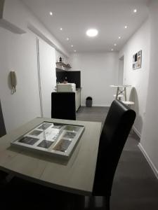 a dining room with a table and a chair at Cumurija Bridge Accommodation in Sarajevo