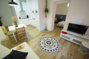 TV a/nebo společenská místnost v ubytování Apartaments Sa Calm Sant Miquel de les Formigues