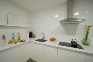 A kitchen or kitchenette at Apartaments Sa Calm Les roques del rei