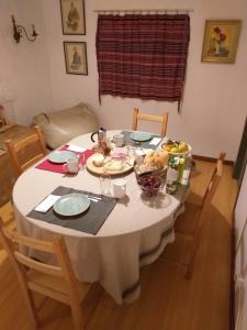 a dining room table with a white table cloth at Casa da Lomba do Cavaleiro in Povoação