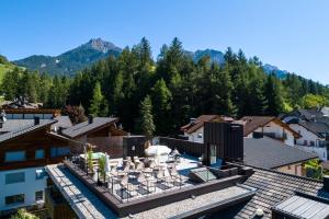 an aerial view of a resort with mountains at Hotel Mirabel in San Vigilio Di Marebbe