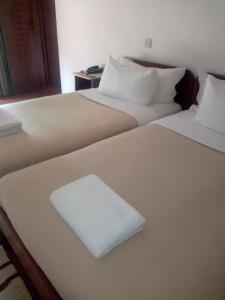 Posteľ alebo postele v izbe v ubytovaní Chaminuka Lodge