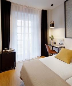 מיטה או מיטות בחדר ב-Hotel Marqués, Blue Hoteles