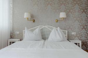 Giường trong phòng chung tại Hotel Hammer
