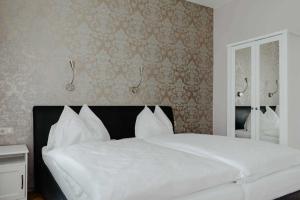 Giường trong phòng chung tại Hotel Hammer