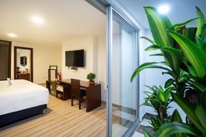 Una cama o camas en una habitación de Loft Hotel Ipiales 20 fotos más