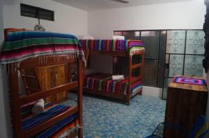 Voodi või voodid majutusasutuse Hostal Las Cruces toas