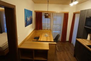 a room with a wooden table in a room at Haus Mozart in Schladming