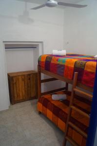Voodi või voodid majutusasutuse Hostal Las Cruces toas