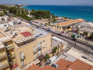 an aerial view of a town with buildings and the ocean at Filmar Hotel, Ixia, Rhodes in Ixia