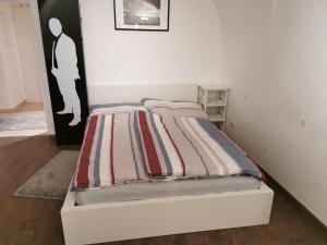 Łóżko lub łóżka w pokoju w obiekcie Zentrale, ruhige Wohnung nahe Murinsel & Kunsthaus
