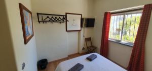 Кровать или кровати в номере Margarida Guest House - Rooms