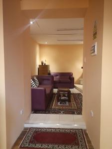 a living room with a couch and a table at Hostal Los Balcones de Moral y Santa Catalina in Arequipa