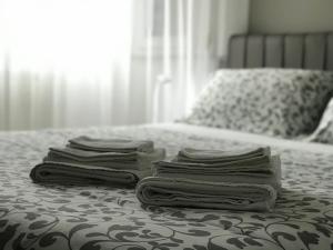 Łóżko lub łóżka w pokoju w obiekcie La Maggiolina camere La Spezia