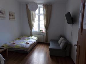 Łóżko lub łóżka w pokoju w obiekcie Apartament Parkowy