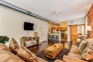 a living room with a couch and a table at JBH 115 W 2nd Apt #2 in Jacksonville
