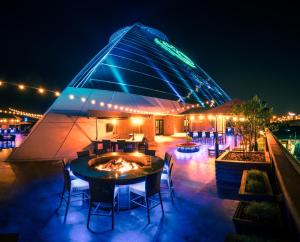 a building with a table and chairs at night at Big Cypress Lodge in Memphis