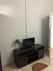 A television and/or entertainment centre at Traditional House “AVLI”