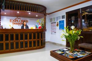 a lobby of a restaurant with a counter and a table at Explorer Deluxe Hotel in Chachapoyas