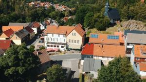 an aerial view of a town with orange roofs at Hotel & Restaurant Druidenstein in Trautenstein