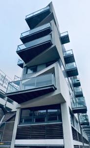 a tall building with balconies on the side of it at Designer Room with Private Bathroom in London