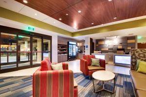 a lobby of a hospital with chairs and a table at Holiday Inn Express & Suites Helen, an IHG Hotel in Helen