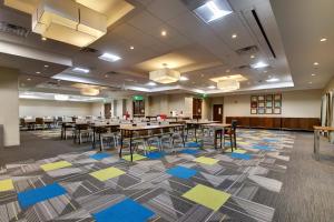 a large banquet hall with tables and chairs at Holiday Inn Express & Suites Helen, an IHG Hotel in Helen