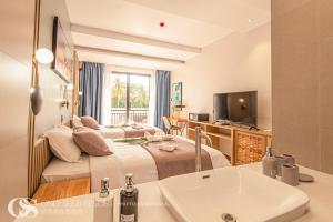 TV a/nebo společenská místnost v ubytování Only Seed Resort 欧芮希度假酒店